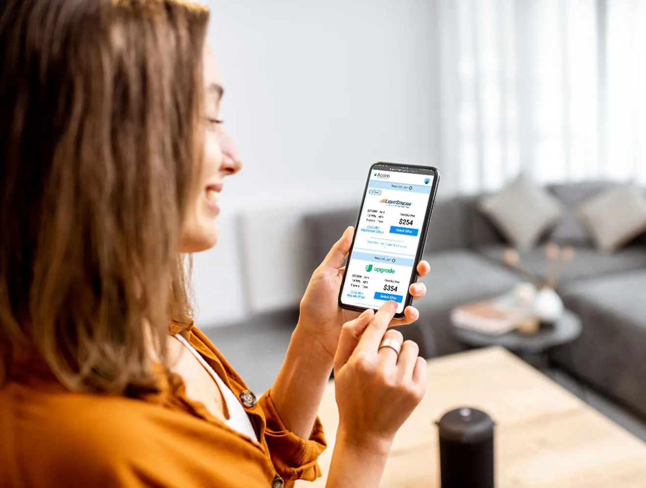 Woman smiling at financial transaction on smartphone via Fiona Template.
